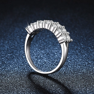 925 silver double-row moissanite ring with brilliant round cut stones on blue surface