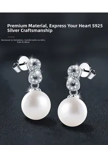 Detailed close-up of S925 sterling silver figure-eight earrings with pearls and zircons
