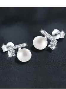 Macro detail of silver pearl earring showing polished finish and 0.03mm plating quality