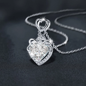 925 sterling silver necklace with heart moissanite pendant and bow detail