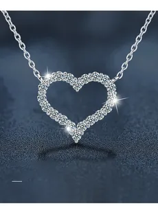 Macro detail of 925 silver heart pendant necklace with 3EX cut sparkling cubic zirconia