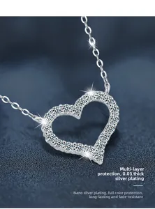 Macro detail of silver heart necklace with cubic zirconia and multi-layer thick plating