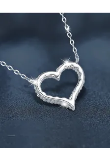 Macro shot of S925 sterling silver heart pendant necklace with shimmering cubic zirconia