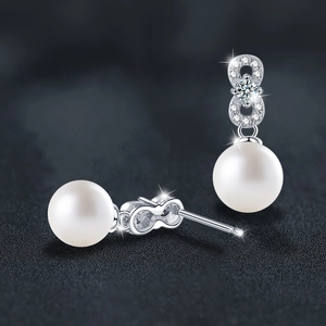 Elegant S925 silver moissanite and round white pearl stud earrings on dark background