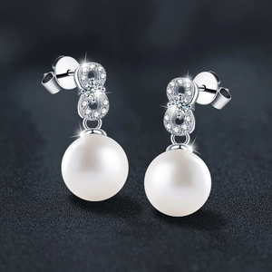 S925 silver moissanite pearl drop earrings with infinity design on dark background