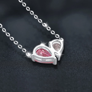 S925 sterling silver necklace with pink pear-shaped zircon heart pendant on black background