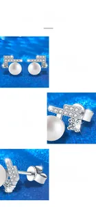 Macro detail of 925 silver pearl earrings with moissanite in four-prong setting