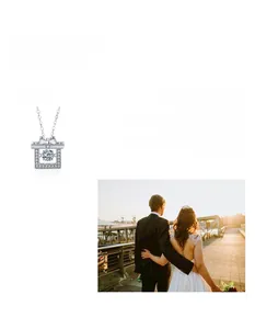 Detailed view of square moissanite necklace pendant with a silver bow tie design