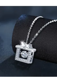 Macro shot of 925 sterling silver bow knot pendant with dancing moissanite stone