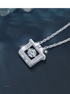 Detailed macro view of S925 silver bow pendant with shimmering moissanite gemstone