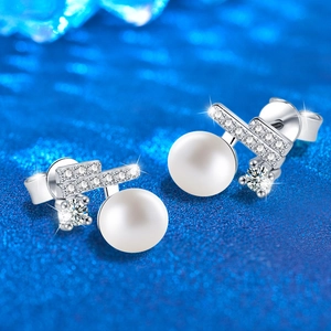 925 sterling silver pearl stud earrings with sparkling moissanite stones on a blue base