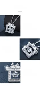 Macro view of 925 silver bow pendant with dancing moissanite and prong setting details