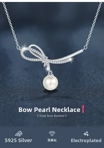 Detailed macro view of S925 silver bow pendant necklace with Moissanite and pearl