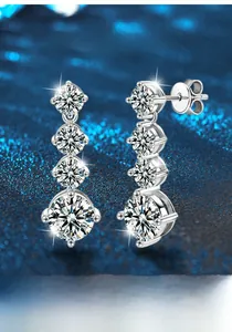 Detailed view of graduated Moissanite earrings in 925 sterling silver with 4-prong setting
