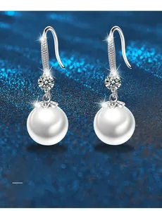 Detail of 925 silver pearl drop earrings with 3EX cut moissanite and S-shaped hook