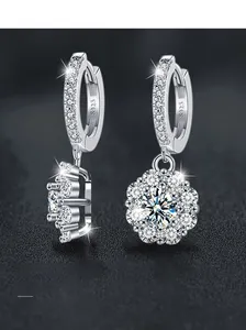 Macro shot of S925 sterling silver sunflower earrings with sparkling moissanite cluster