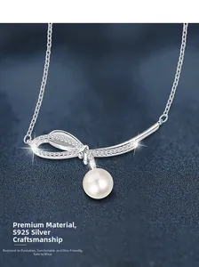 Macro detail of S925 sterling silver bow necklace with a round white pearl pendant