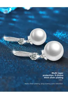 Macro detail of 925 silver pearl earring with nano-silver plating for long-lasting color