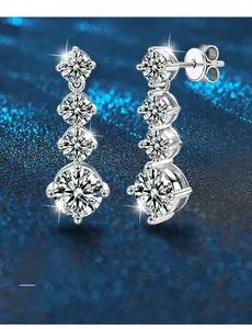 Macro detail of 925 silver drop earrings with four-stone graduated moissanite gems