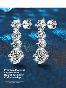 Detail of four-stone S925 sterling silver drop earrings with graduated moissanite stones
