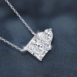 925 sterling silver necklace featuring heart and princess cut moissanite pendants