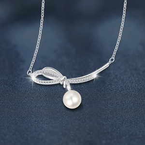 925 silver necklace with sparkling bow pendant and elegant white pearl drop for women