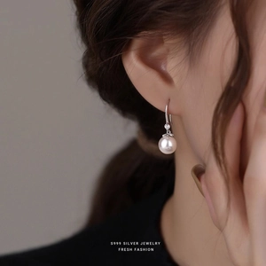 Elegant S999 sterling silver pearl drop earrings featuring round pearls and tiny diamonds