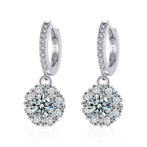 Elegant S925 sterling silver sunflower moissanite drop earrings on white reflective background