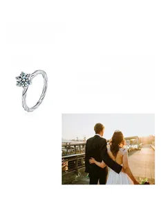 Detail of a six-prong moissanite ring with a twisted silver band and radiant finish