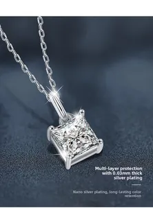 Macro detail of 925 silver necklace featuring a square moissanite in 4-prong setting