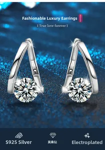 Macro detail of S925 sterling silver V-shape earrings with moissanite in a 4-prong setting