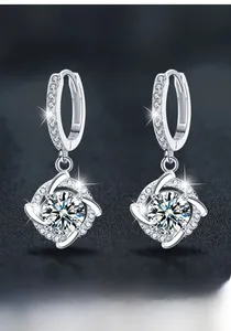 Detailed close-up of Moissanite windmill earrings in S925 sterling silver with a round hoop