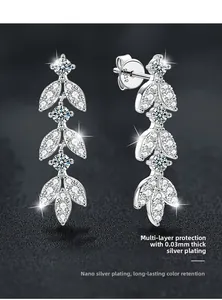 Macro shot of S925 sterling silver tassel earrings with leaf-shaped moissanite stones