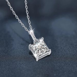 Elegant 925 sterling silver necklace with a princess cut moissanite pendant on blue background