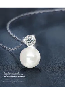 Macro shot of 925 silver pearl pendant with sparkling moissanite detail and fine chain