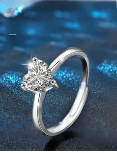 Macro shot of 3EX cut heart moissanite with 58 facets and 925 silver 3-prong setting