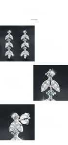Detailed macro view of S925 sterling silver stamp and leaf-shaped moissanite earrings