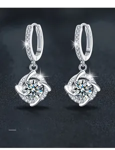 Macro shot of 925 sterling silver windmill earrings with moissanite cluster studs