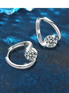 Macro shot of S925 sterling silver hoop earrings with round cut moissanite and S925 hallmark