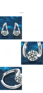 Macro shot of 925 sterling silver moissanite earrings with mirror finish and claw setting