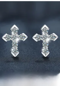 Macro shot of S925 silver cross stud earrings with sparkling moissanite stones
