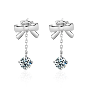 Elegant 925 sterling silver bow earrings featuring hanging moissanite gemstones