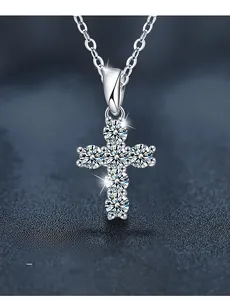Close-up of moissanite cross pendant with 58 facets and 3EX cut silver necklace