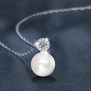 Elegant 925 sterling silver necklace featuring a large white freshwater pearl and moissanite