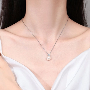 Elegant 925 sterling silver necklace featuring a white freshwater pearl and moissanite pendant