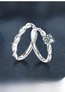 Macro detail of s925 silver twist couple rings with moissanite on starry background