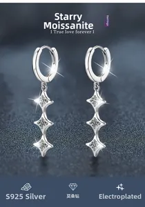 Detail of S925 sterling silver drop earrings with moissanite stars and tassels