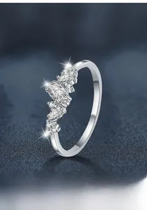 Detailed macro view of S925 sterling silver moissanite ring with marquise cut stones