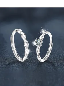 Macro shot of S925 sterling silver twist couple rings with a sparkling moissanite stone