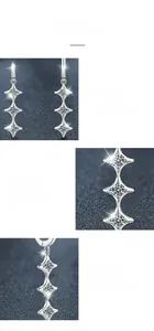 Detailed view of S925 sterling silver moissanite drop earrings with four-prong settings